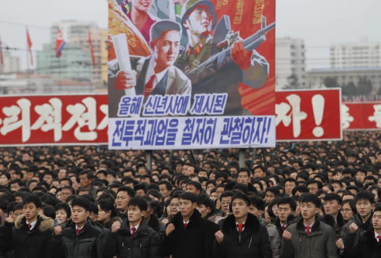 North Koreans taking part in a government rally (Rex)