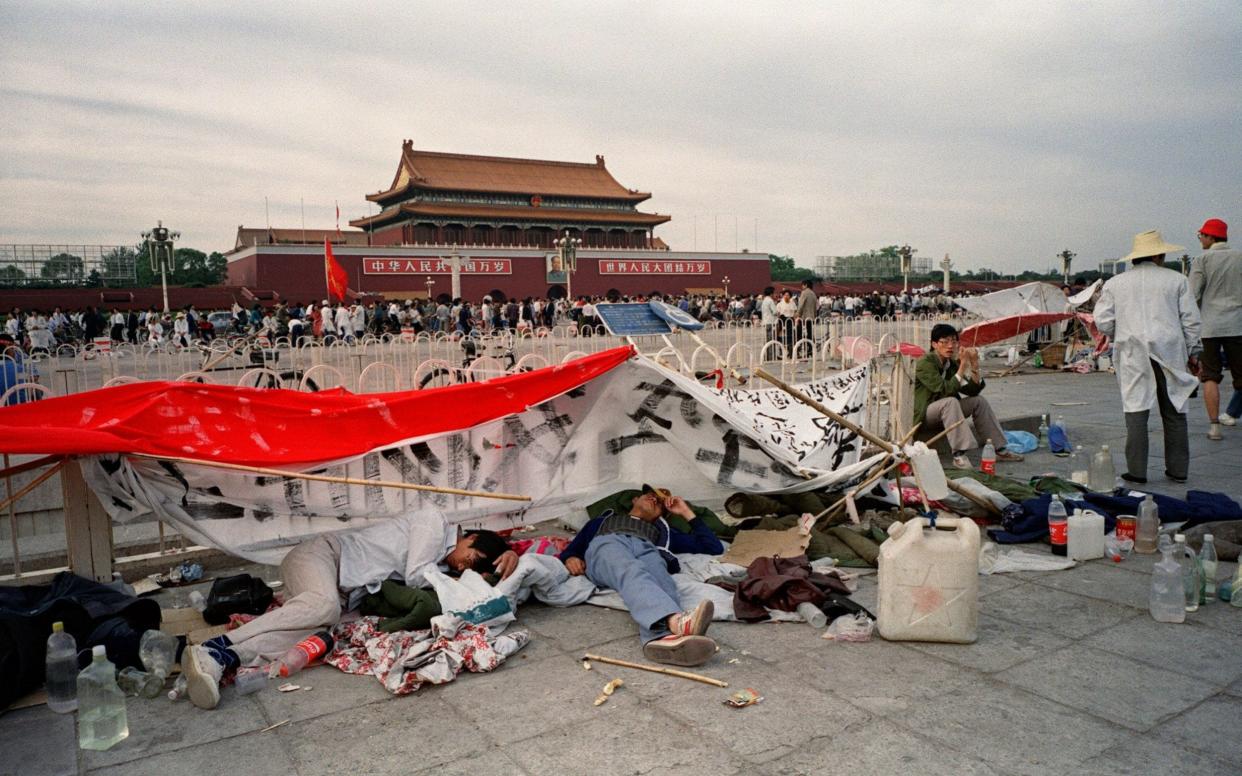 Students sleeping on the ground at Tiananmen Square in Beijing on May 21, 1989  - AFP