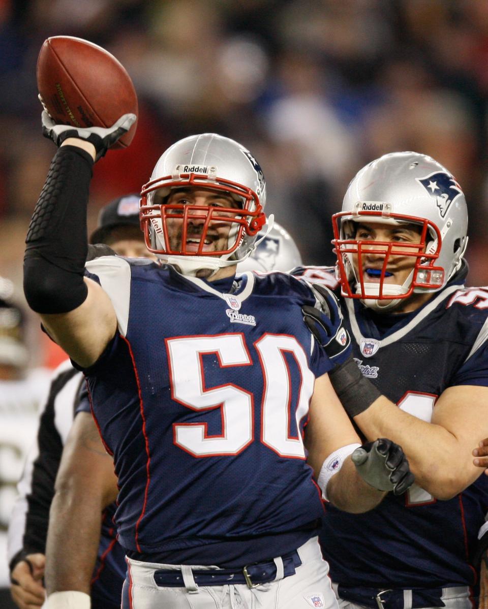 New England Patriots linebacker Mike Vrabel (50) celebrates his fumble recovery with teammate Tedy Bruschi, right, after Jacksonville Jaguars quarterback David Garrard lost the ball while getting sacked in the first half of an NFL divisional playoff football game Saturday, Jan. 12, 2008, in Foxborough, Mass.