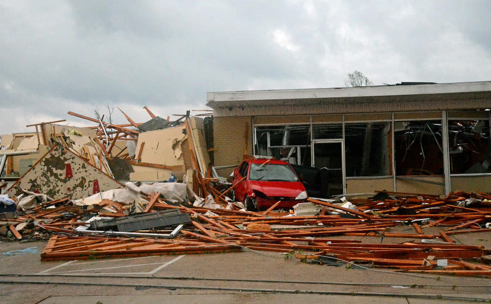 A building is damaged in Tupelo, Miss. Monday, April 28, 2014. Tornados flattened homes and businesses, flipped trucks over on highways and injured numerous people in Mississippi and Alabama on Monday as a massive, dangerous storm system passed over several states in the South, threatening additional twisters as well as severe thunderstorms, damaging hail and flash floods. (AP Photo/The Daily Mississippian, Ignacio Murillo)