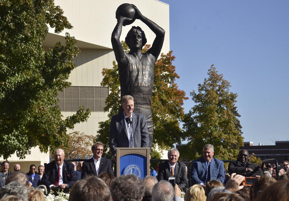 FILE - Former Indiana State basketball player Larry Bird addresses the crowd gathered for the unveiling of a statue of Bird, Saturday, Nov. 9, 2013 in Terre Haute, Ind. The 19-foot, 4,000-pound statue of Kobe Bryant in downtown Los Angeles is just the latest example of a sports team honoring a player with this kind of larger-than-life presence. Indiana State’s campus has a 15-foot, 1,900-pound statue of Bird. (AP Photo/Tribune-Star, Joseph C. Garza, File)