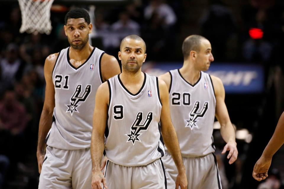 Tony Parker, center, helped the Spurs to four NBA championships.