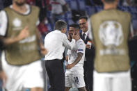 Italy's Lorenzo Insigne, right, celebrates with Italy's manager Roberto Mancini after scoring his side's third goal during the Euro 2020 soccer championship group A match between Italy and Turkey at the Olympic stadium in Rome, Friday, June 11, 2021. (Alberto Lingria/Pool Photo via AP)