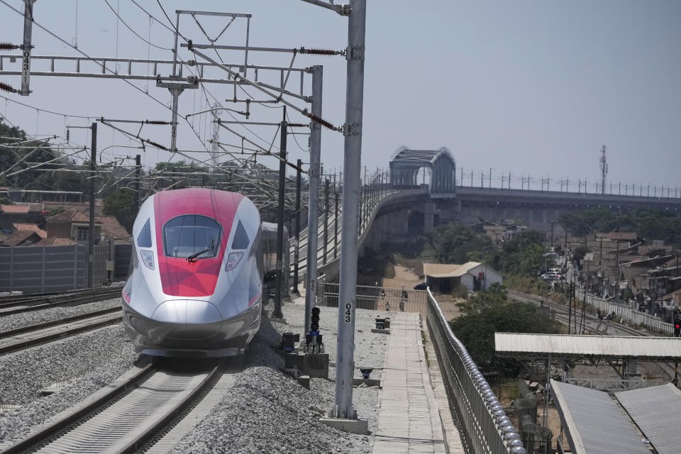 High-speed train is seen during the opening ceremony for launching Southeast Asia's first high-speed railway at Padalarang station in Bandung, West Java, Indonesia, Monday, Oct. 2, 2023. Indonesian President Joko Widodo launched Southeast Asia's first high-speed railway that will start its commercial operations on Monday, a key project under China's Belt and Road infrastructure initiative that will cut travel time between two cities from the current three hours to about 40 minutes. (AP Photo/Achmad Ibrahim)