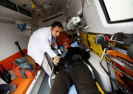 Chinese climber Liu Lei, who says he successfully climbed Mount Everest, gets a checkup inside an ambulance after returning from Mount Everest summit in Kathmandu, Nepal, May 24, 2016. REUTERS/Navesh Chitrakar