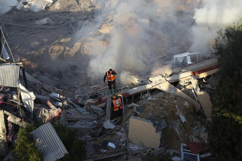 Palestinian emergency services look for survivors after an Israeli strike on a residential building in Rafah, Monday, Feb. 19, 2024. (AP Photo/Hatem Ali)