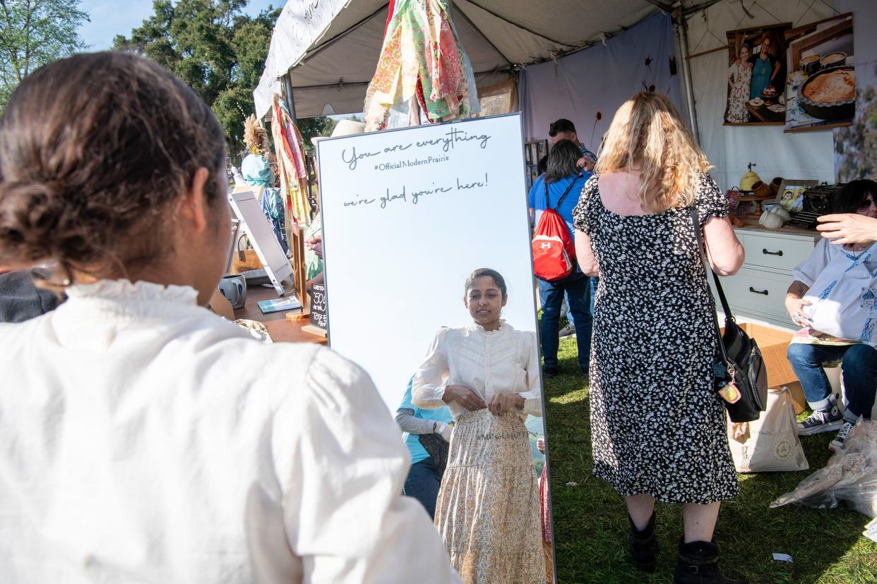 Women tried on bonnets and prairie-inspired clothes at the "Little House" festival celebrating 50 years of the show. Modern Prairie sold prairie-inspired blouses and skirts, dresses and nightgowns.