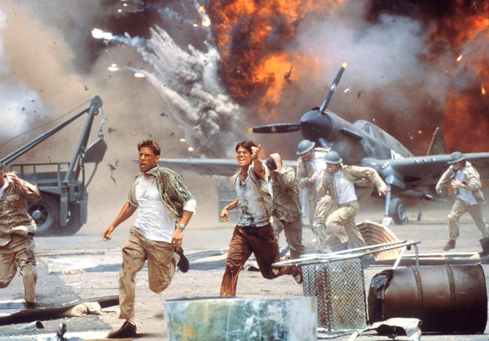 Ben Affleck (left) and Josh Hartnett star as pilots scrambling to get to their planes during a surprise Japanese attack in the World War II drama "Pearl Harbor."