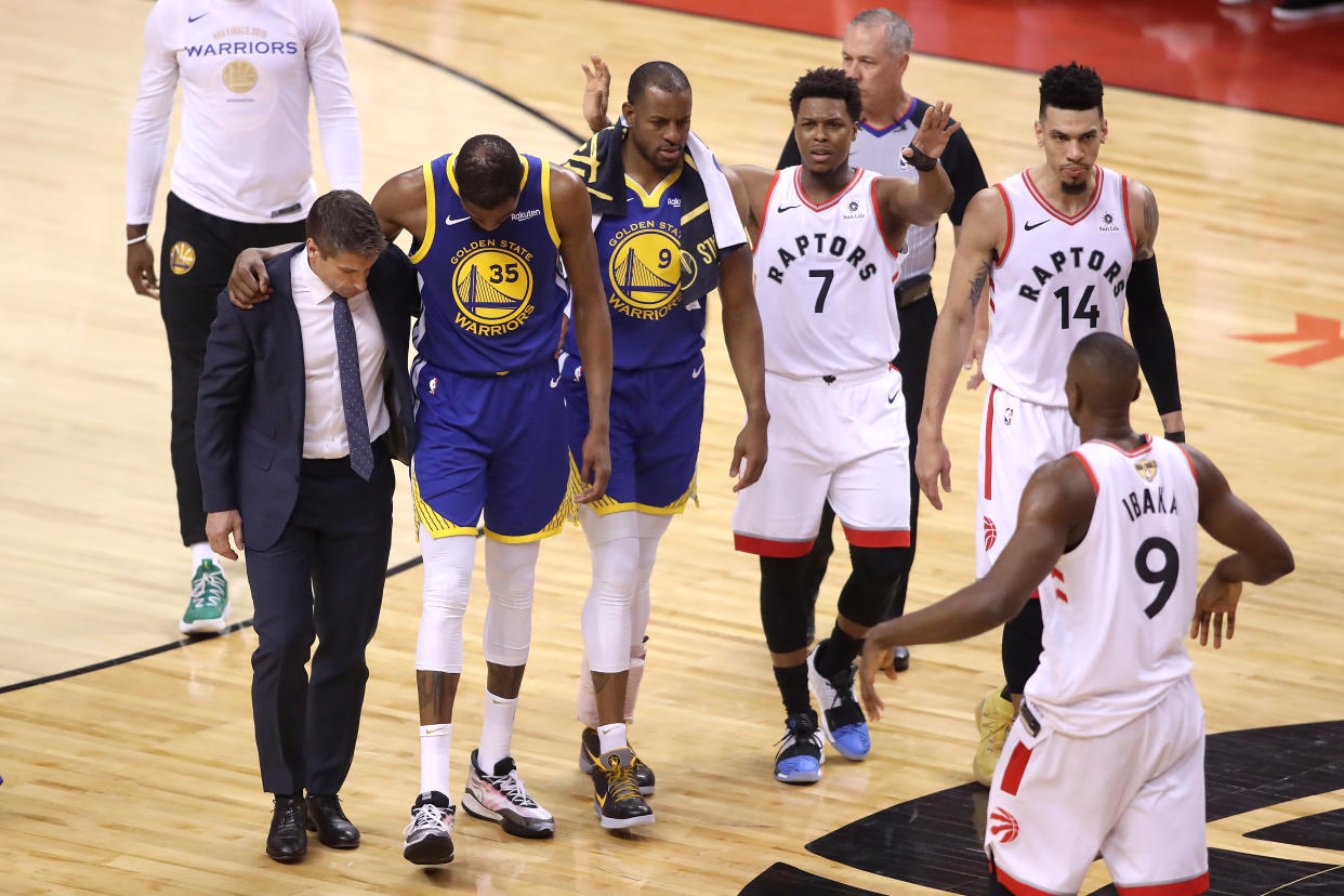 Kyle Lowry #7 of the Toronto Raptors reacts as Kevin Durant #35 of the Golden State Warriors is carried off the court in the first half during Game Five of the 2019 NBA Finals at Scotiabank Arena on June 10, 2019 in Toronto, Canada. NOTE TO USER: User expressly acknowledges and agrees that, by downloading and or using this photograph, User is consenting to the terms and conditions of the Getty Images License Agreement. (Photo by Claus Andersen/Getty Images)