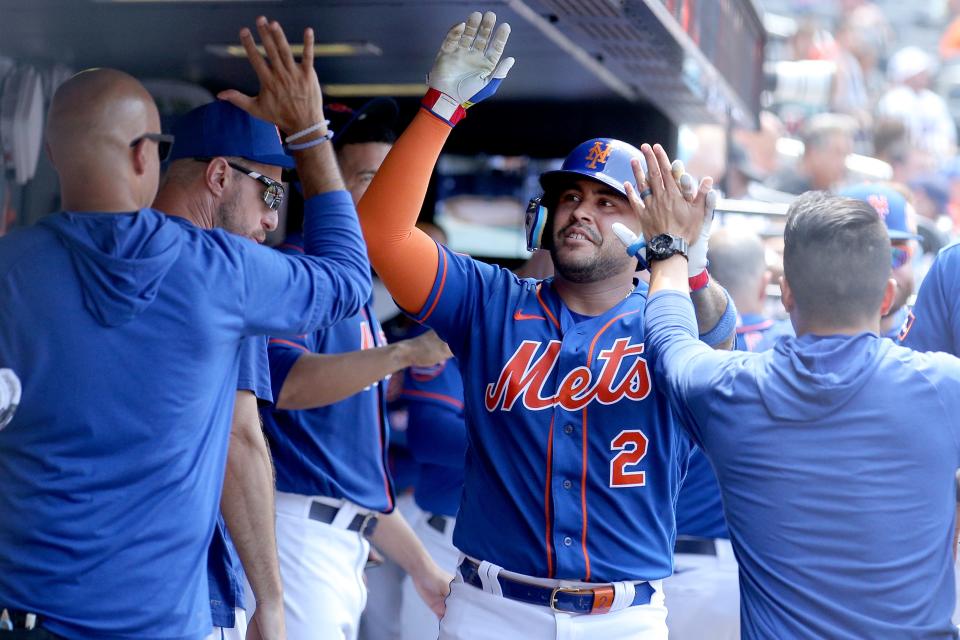 New York Mets catcher Omar Narvaez (2) celebrates his solo home run against the Chicago White Sox with teammates in the dugout during the fifth inning on July 20, 2023, at Citi Field.