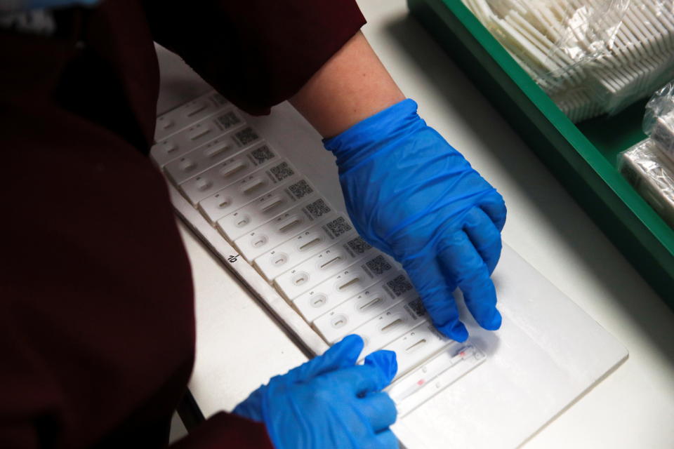 A worker assembles PCP coronavirus disease (COVID-19) test kits at the SureScreen Diagnostics, amidst the coronavirus disease (COVID-19) outbreak, in Derby, Britain February 8, 2021. REUTERS/Phil Noble/Pool