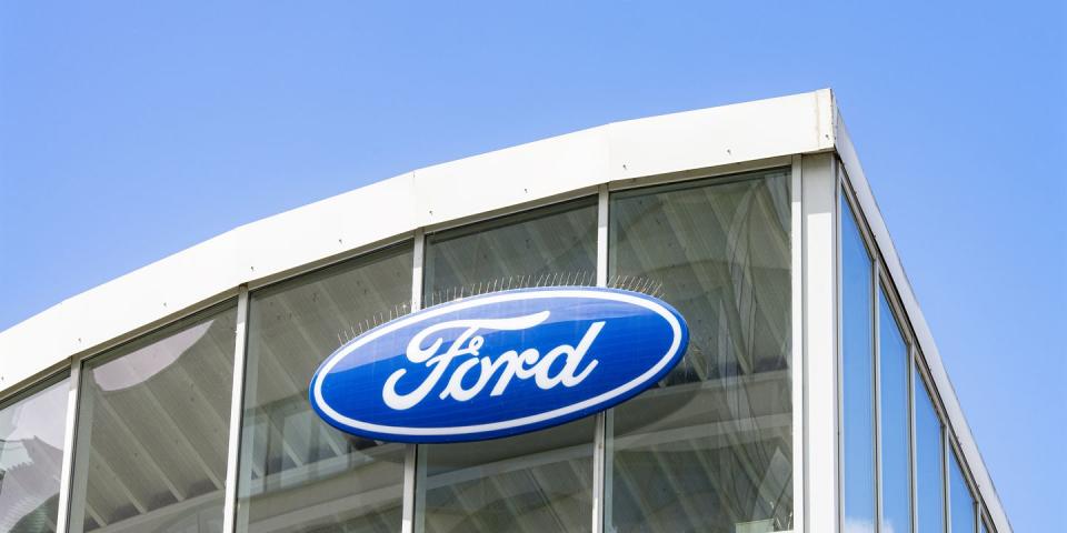 logo of ford at a car dealership