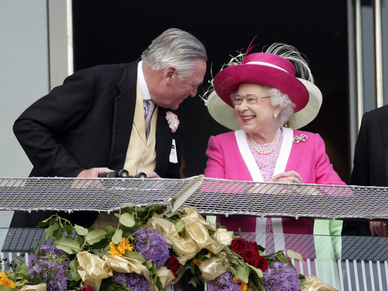 EPSOM, UNITED KINGDOM - JUNE 04: (EMBARGOED FOR PUBLICATION IN UK NEWSPAPERS UNTIL 48 HOURS AFTER CREATE DATE AND TIME) Lord Samuel Vestey, Master of the Horse talks with Queen Elizabeth II on the balcony of the Royal Box as they attend Derby Day at the Investec Derby Festival at Epsom racecourse on June 4, 2011 in Epsom, England. (Photo by Indigo/Getty Images)