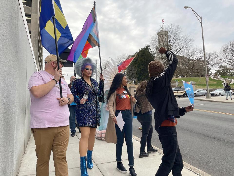 Advocates who oppose a bill that would restrict where certain drag shows could take place march from a rally outside of the Tennessee Capitol in Nashville on Feb. 14 to the Cordell Hull legislative building.