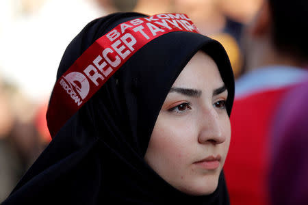 FILE PHOTO: A supporter of Turkish President Tayyip Erdogan attends a pre-election gathering in Istanbul, Turkey, June 20, 2018. REUTERS/Huseyin Aldemir/File Photo