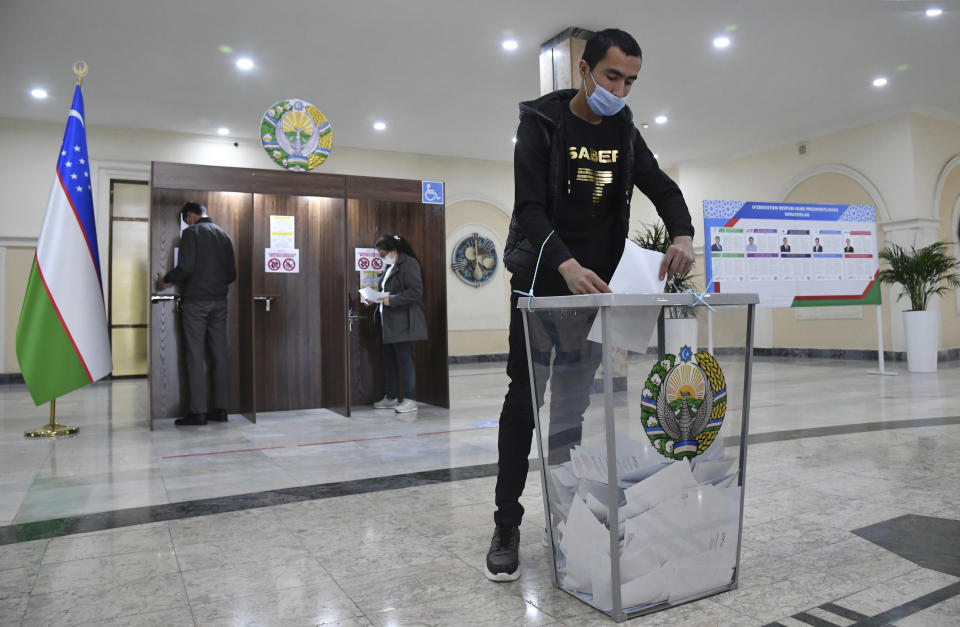 A man casts his ballot at a polling station during the presidential election in Tashkent, Uzbekistan, Sunday, Oct. 24, 2021. Uzbeks voted Sunday in a presidential election that the incumbent is expected to win in a landslide against weak competition. Although Shavkat Mirziyoyev has relaxed many of the policies of his dictatorial predecessor, he has made little effort at political reform. He took office in 2016 upon the death of Islam Karimov and faces four relatively low-visibility candidates who did not even show up for televised debates. (AP Photo)