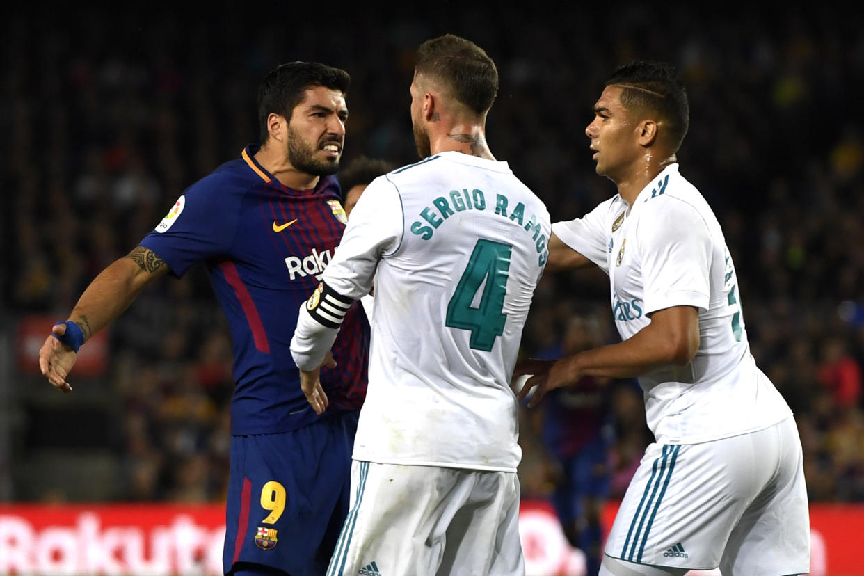 Luis Suarez and Sergio Ramos were two of the chief instigators in a wild game between Barcelona and Real Madrid. (Getty)
