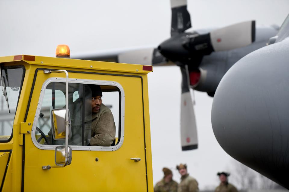 Master Sgt. Cory Matousek with the Mansfield-based Ohio Air National Guard 179th Airlift Wing keeps his eye on the wings as he navigates a C-130H Hercules to the MAPS Air Museum in Green.