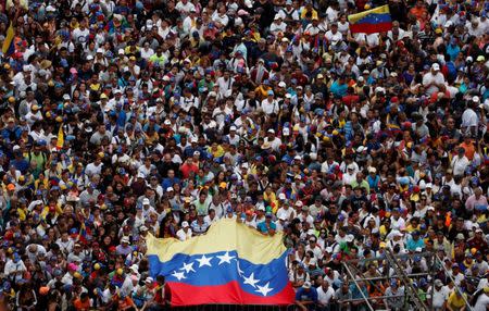 Opposition supporters take part in a rally against Venezuelan President Nicolas Maduro's government and to commemorate the 61st anniversary of the end of the dictatorship of Marcos Perez Jimenez in Caracas, Venezuela January 23, 2019. REUTERS/Carlos Garcia Rawlins