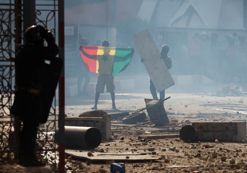 FILE PHOTO: Supporters of opposition leader Ousmane Sonko clash with security forces, in Dakar