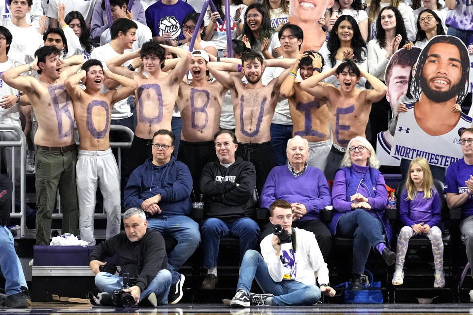 Fans celebrate after Northwestern guard Boo Buie scored during the second half of an NCAA college basketball game against Minnesota in Evanston, Ill., Saturday, March 9, 2024. (AP Photo/Nam Y. Huh)