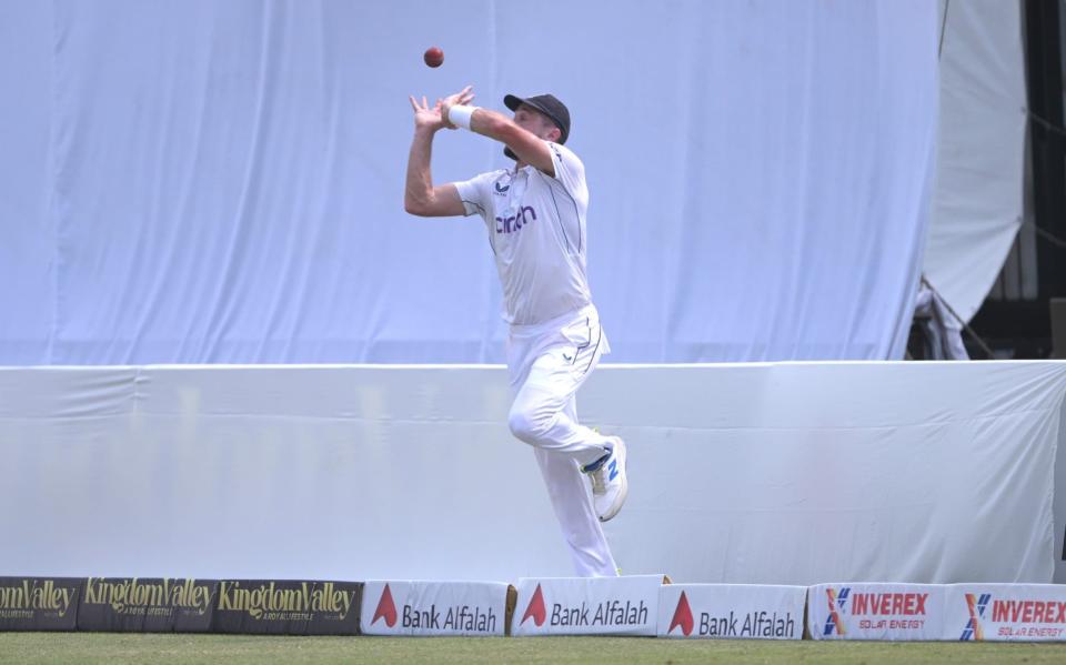 Chris Woakes attempts to pull off a catch on the boundary