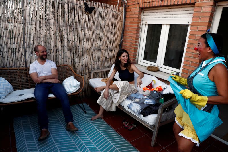 Actress and puppeteer Yohana Yara impersonates "Florina" for artists Jerome Rader and Alicia Lorente, at her home in Madrid