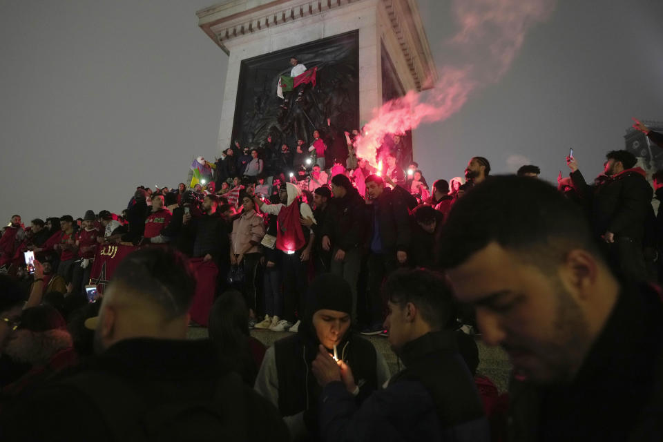 FILE - Morocco soccer fans celebrate after the national team beat Canada 2-1 and qualified to the knockout stages of the World Cup played in Qatar, in Trafalgar Square, London, Thursday, Dec. 1, 2022. (AP Photo/Kin Cheung, File)