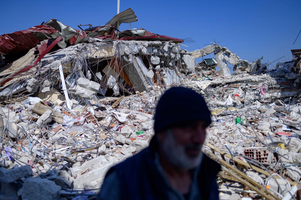 A resident stands in front of his destroyed home in Samandag, south of Hatay on Feb. 16, 2023, ten days after a 7.8-magnitude struck the border region of Turkey and Syria.<span class="copyright">Yasin Akgul—AFP/Getty Images</span>