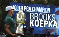 FILE - In this Aug. 12, 2018, file photo, Brooks Koepka holds the Wanamaker Trophy after winning the PGA Championship golf tournament at Bellerive Country Club in St. Louis. Koepka will try this week to become the first player to win three straight PGAs in stroke play. (AP Photo/Charlie Riedel, File)