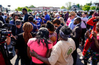 FILE - People gather outside the scene of a shooting at a supermarket, in Buffalo, N.Y., on May 15, 2022. The NAACP, the nation's oldest civil rights organization said it will propose a sweeping plan meant to protect Black Americans from white supremacist violence, in response to a hate-fueled massacre that killed 10 Black people in Buffalo, New York last weekend. (AP Photo/Matt Rourke, File)