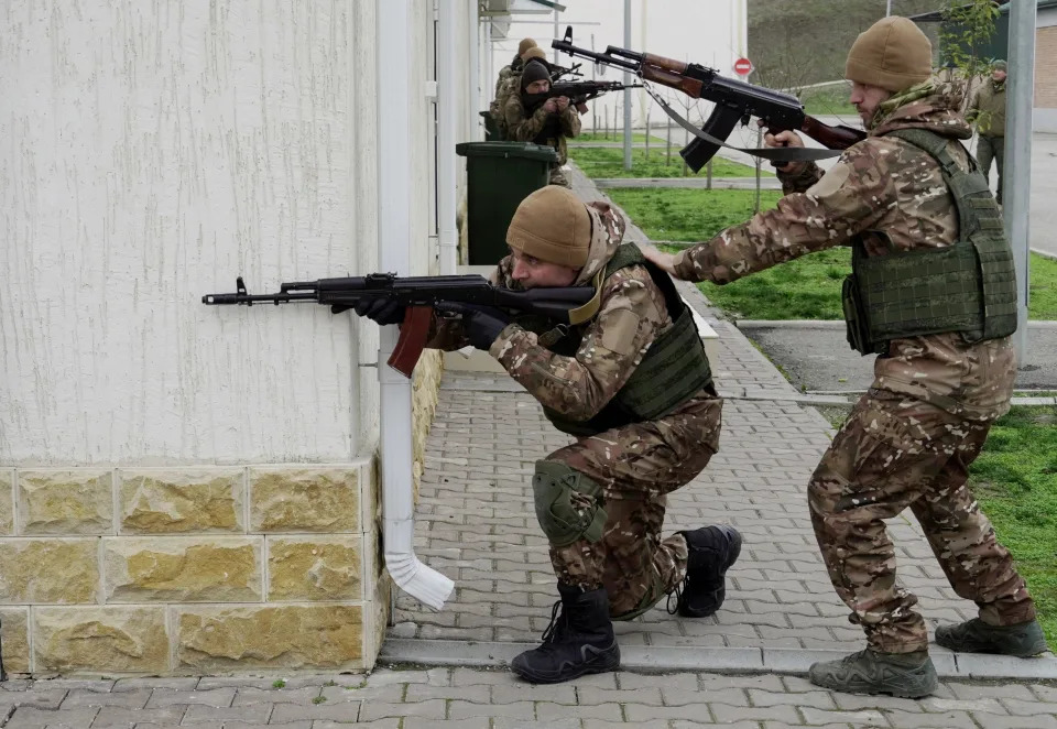 Chechen special forces troops take up firing positions as they attend a training session at a "Russian University of Special Forces" training centre in the town of Gudermes in Chechnya on December 13, 2022.