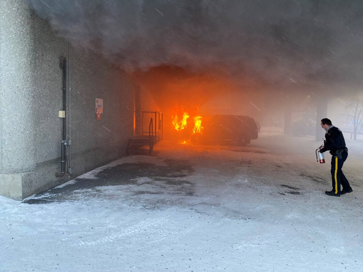 A vehicle fire in the covered parking area of the Yellowknife courthouse on Monday resulted in scheduled court appearances being suspended for the day.  (Submitted by Jonathan Renko - image credit)