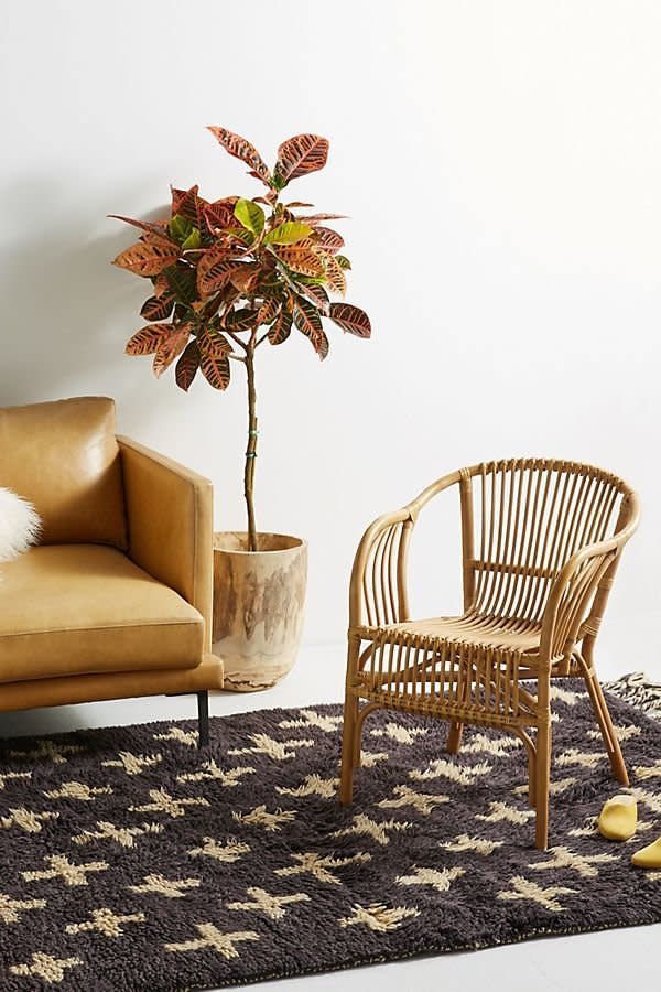 Get it at <a href="https://www.anthropologie.com/shop/pari-rattan-chair" target="_blank" rel="noopener noreferrer">Anthropologie</a>, $98.&nbsp;