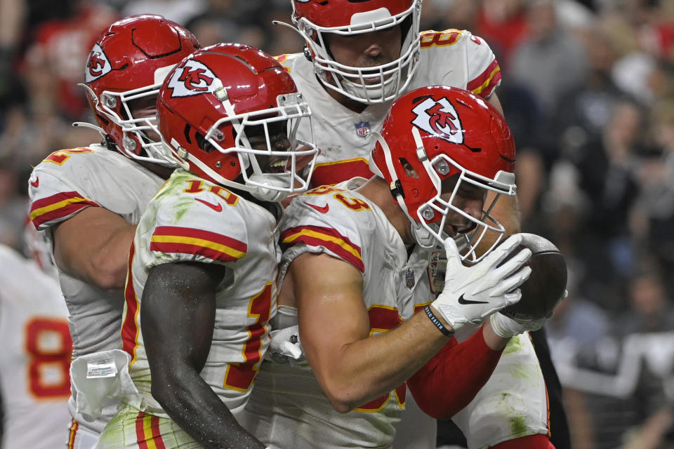 Kansas City Chiefs tight end Noah Gray, right, celebrates after scoring a touchdown against the Las Vegas Raiders during the second half of an NFL football game, Sunday, Nov. 14, 2021, in Las Vegas. (AP Photo/David Becker)
