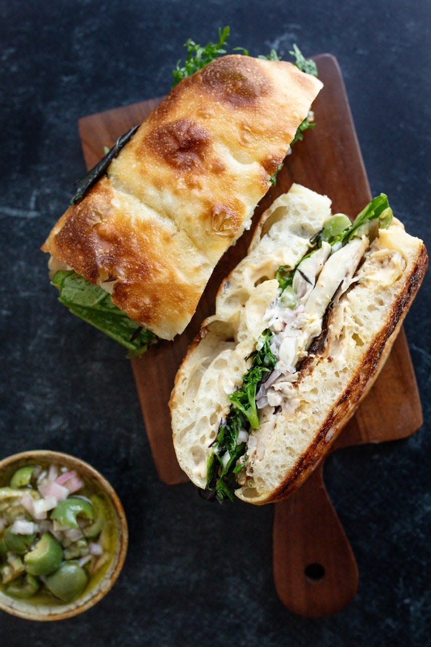 Flour, a new restaurant at S&W Market, offers a roast chicken salad focaccia made with Castelvetrano olives, Calabrian chili aioli and local lettuce.