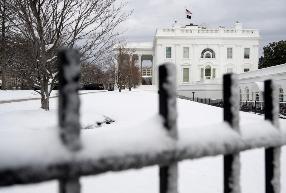 Snow blankets the North Lawn of the White House in Washington, DC, on January 16 (AFP via Getty Images)