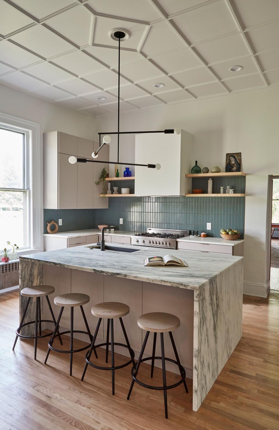 “We did the same marble throughout,” says Nick, referring to the Vermont Danby marble countertops and island. “While we did want to modernize, I felt like a contrasting island wouldn’t be one hundred percent true to the historic nature of the house.”