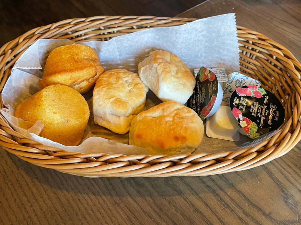 Biscuits and cornbread in a basket at Cracker Barrel