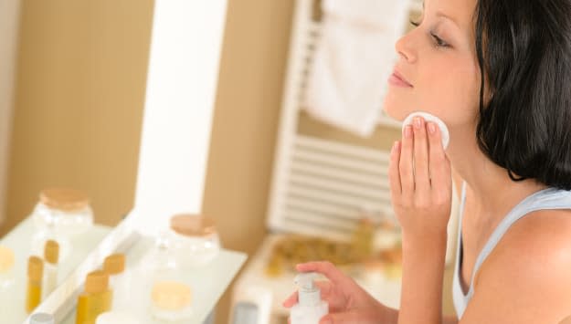 young woman in bathroom clean...