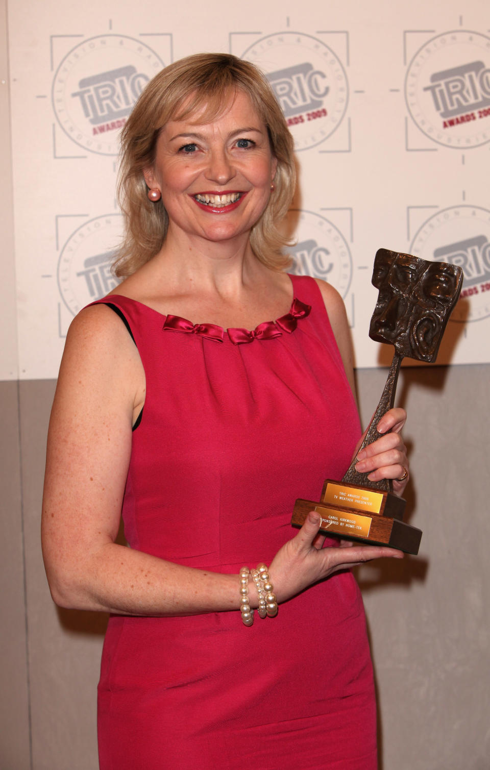 LONDON - MARCH 10: Carol Kirkwood poses with award for 'best TV weather presenter' in front of the winners boards at Television and Radio Industries Club (TRIC) awards held at Grosvenor House, Park Lane on March 10, 2009 in London, England. (Photo by Tim Whitby/Getty Images)