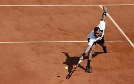 Jo-Wilfried Tsonga of France returns the ball to Stan Wawrinka of Switzerland during their men's semi-final match at the French Open tennis tournament at the Roland Garros stadium in Paris, France, June 5, 2015. REUTERS/Vincent Kessler