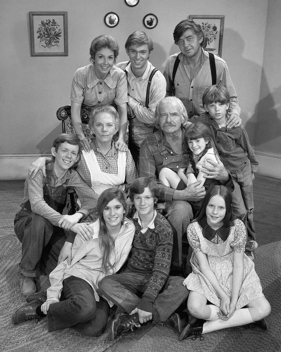 This photo provided by CBS in September 2022 shows actors in the television series "The Waltons.” Bottom row from left are Judy Norton-Taylor, Eric Scott and Mary Elizabeth McDonough. Second row from left are Jon Walmsley, Ellen Corby, Will Geer, Kami Cotler and David W. Harper. Top row from left are Michael Learned, Richard Thomas and Ralph Waite. (CBS Photo Archive via AP)