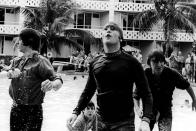 <p>The Beatles climb out of a pool while filming a movie, tentatively called, <em>Beatles 2</em>, in the Bahamas in 1965.</p>