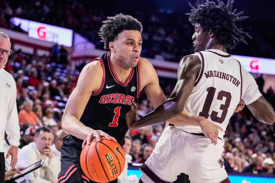 Georgia guard Jabri Abdur-Rahim (1) dribbles against Texas A&M forward Solomon Washington during a game in March. On Monday, he committed to Providence.