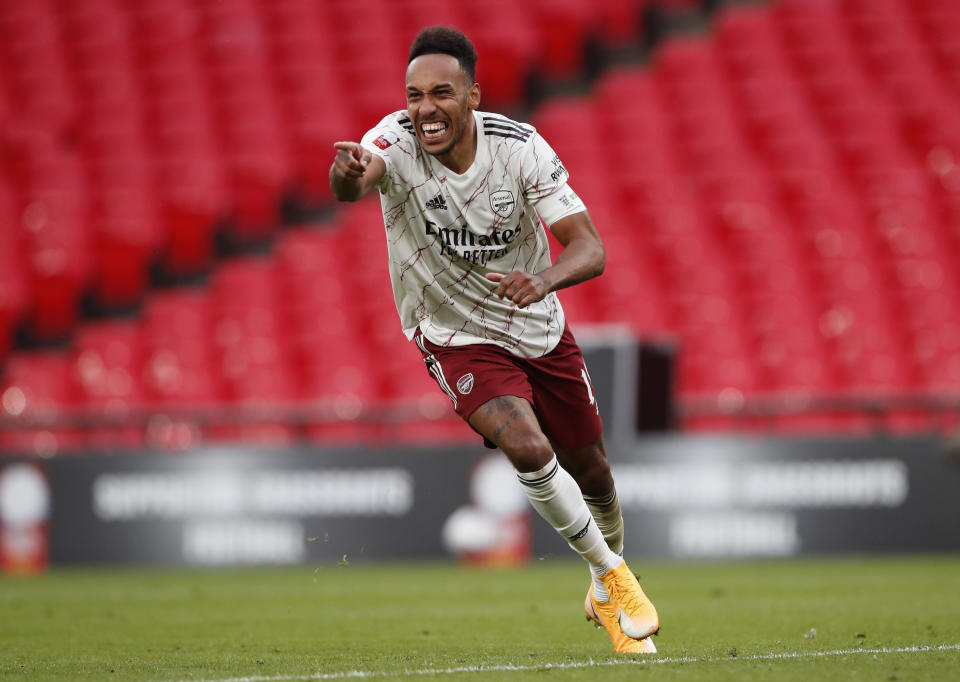 Arsenal's Pierre-Emerick Aubameyang celebrates after scores the winning penalty in a penalty shootout at the end of the English FA Community Shield soccer match between Arsenal and Liverpool at Wembley stadium in London, Saturday, Aug. 29, 2020. (Andrew Couldridge/Pool via AP)