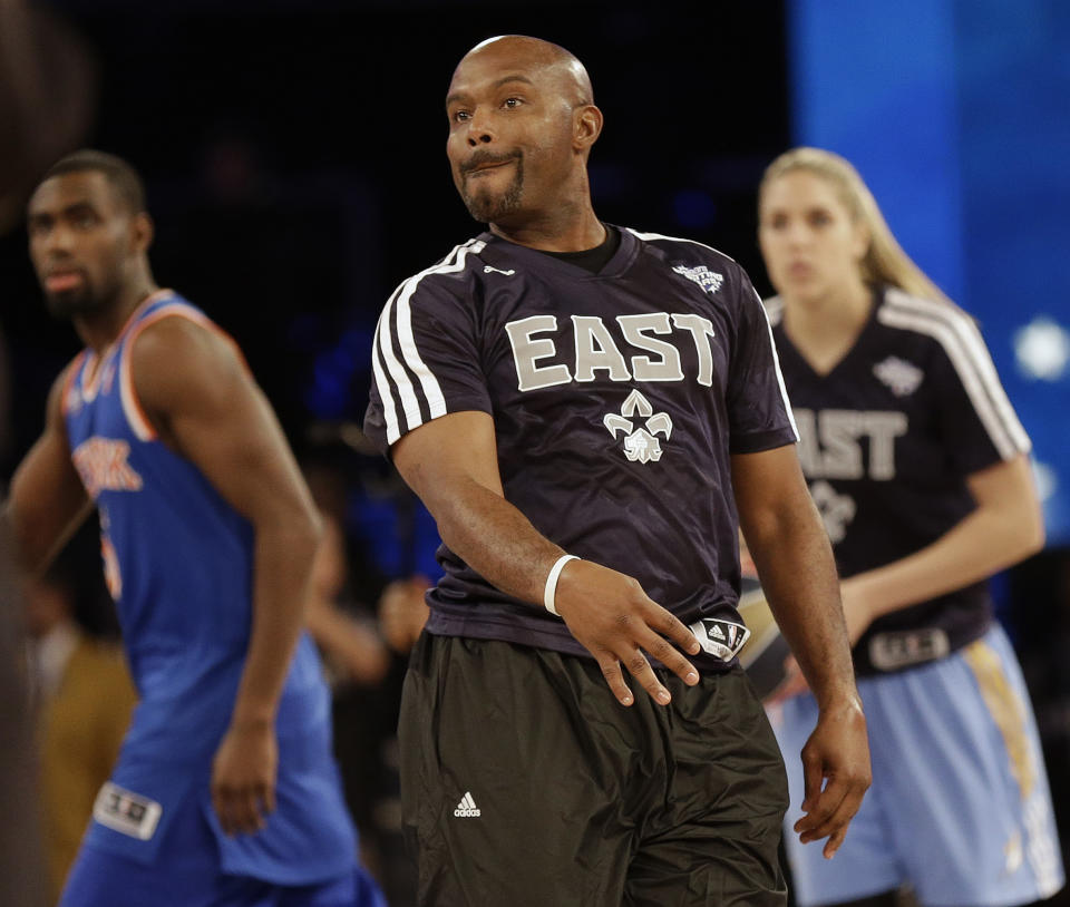 Former NBA player Tim Hardaway Sr. watches his shot during the skills competition at the NBA All Star basketball game, Saturday, Feb. 15, 2014, in New Orleans. (AP Photo/Gerald Herbert)
