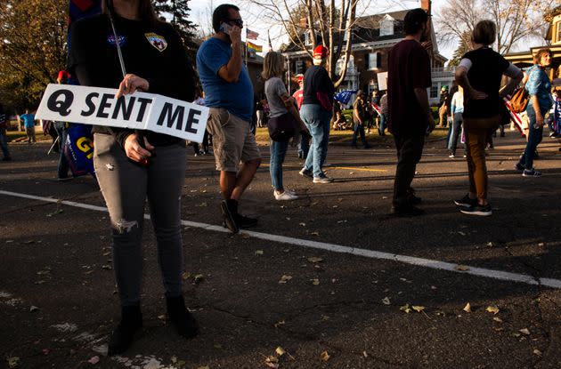 A woman holds a sign referencing the QAnon conspiracy as supporters of President Donald Trump gather outside the Governor's Mansion on Nov. 7, 2020, in St. Paul, Minnesota. (Photo: Stephen Maturen via Getty Images)