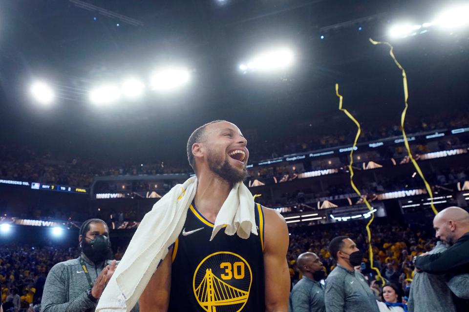 Golden State Warriors guard Stephen Curry celebrates after the Warriors defeated the Dallas Mavericks in Game 5 of the NBA basketball playoffs Western Conference finals in San Francisco, Thursday, May 26, 2022. (AP Photo/Jeff Chiu)