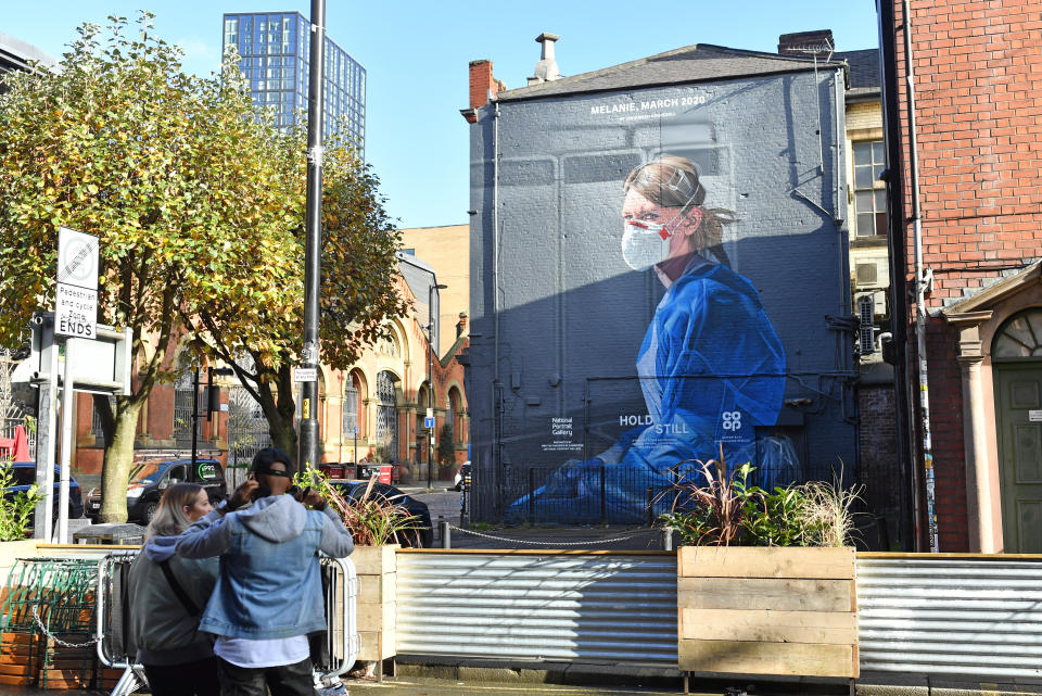 A mural depicting a health worker by artist Peter Barber in Manchester as the Government is preparing to impose stringent new coronavirus controls on 2.8 million people after talks with the local leaders for Greater Manchester failed to reach agreement. Leaders have been given until midday on Tuesday to reach a deal, or face unilateral Government action, after 10 days of negotiations failed to reach an agreement. (Photo by Jacob King/PA Images via Getty Images)